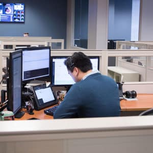 technology specialist working on computer