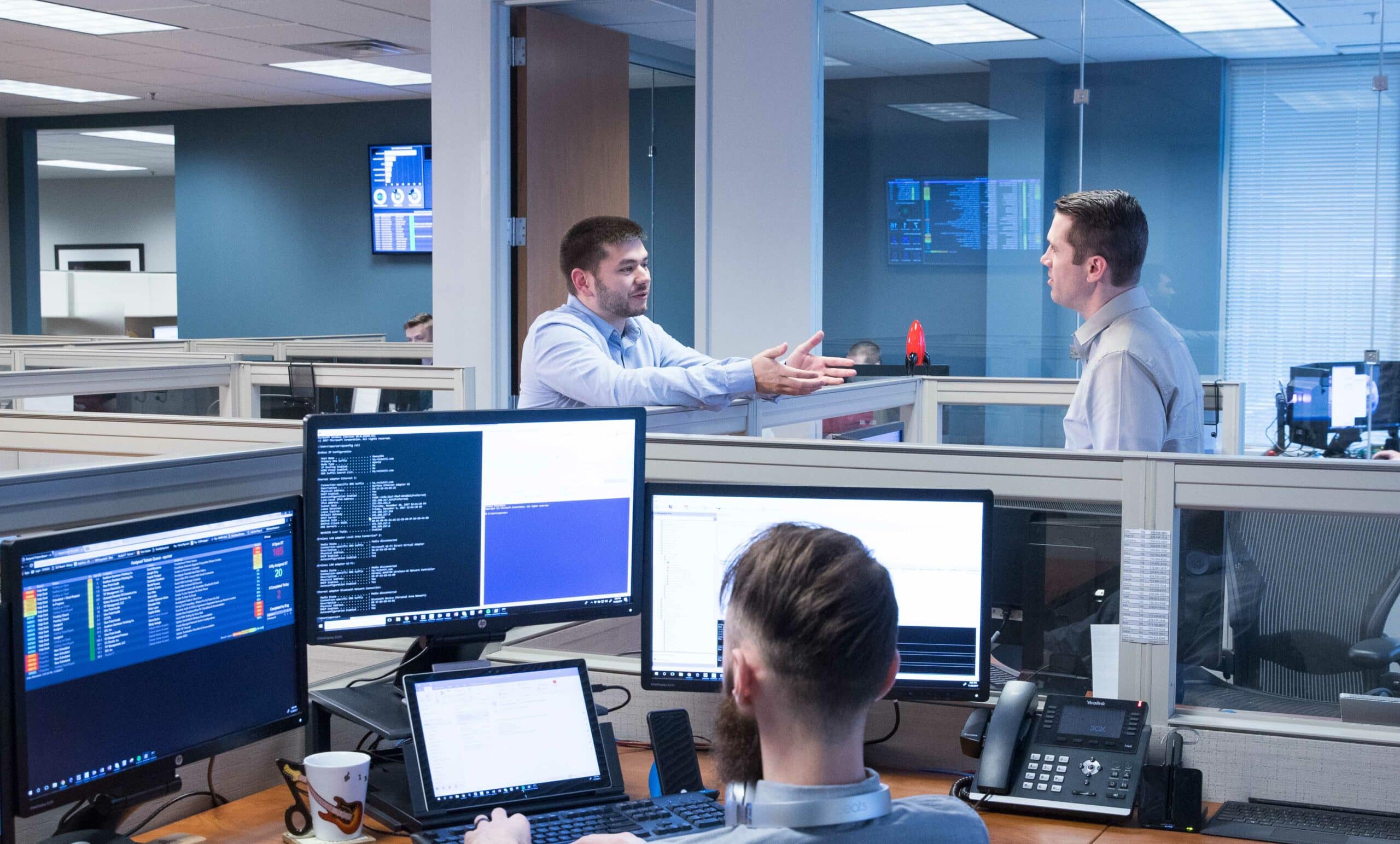 team of people discussing ideas in an open office environment