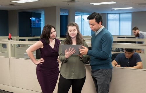 Technology Team Collaborating on a tablet computer in an office